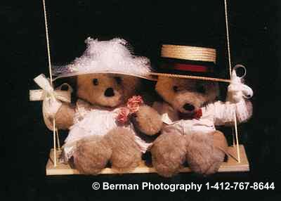 Victorian Teddy Bears enjoying a romantic moment on a swing. 