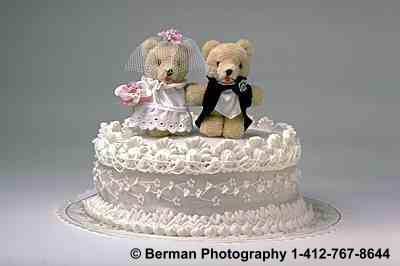 Teddy Bears on a wedding cake.